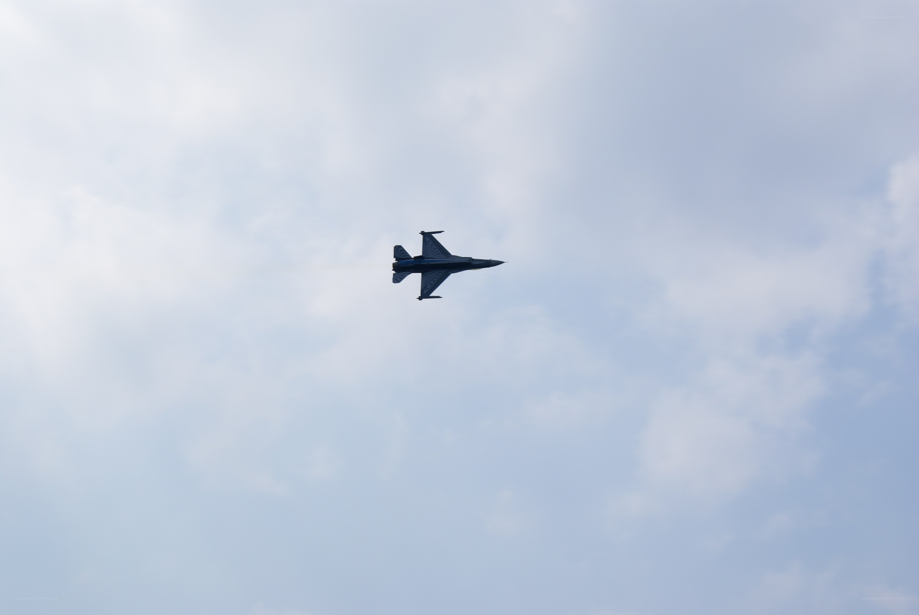 Jet fighter in cloudy sky