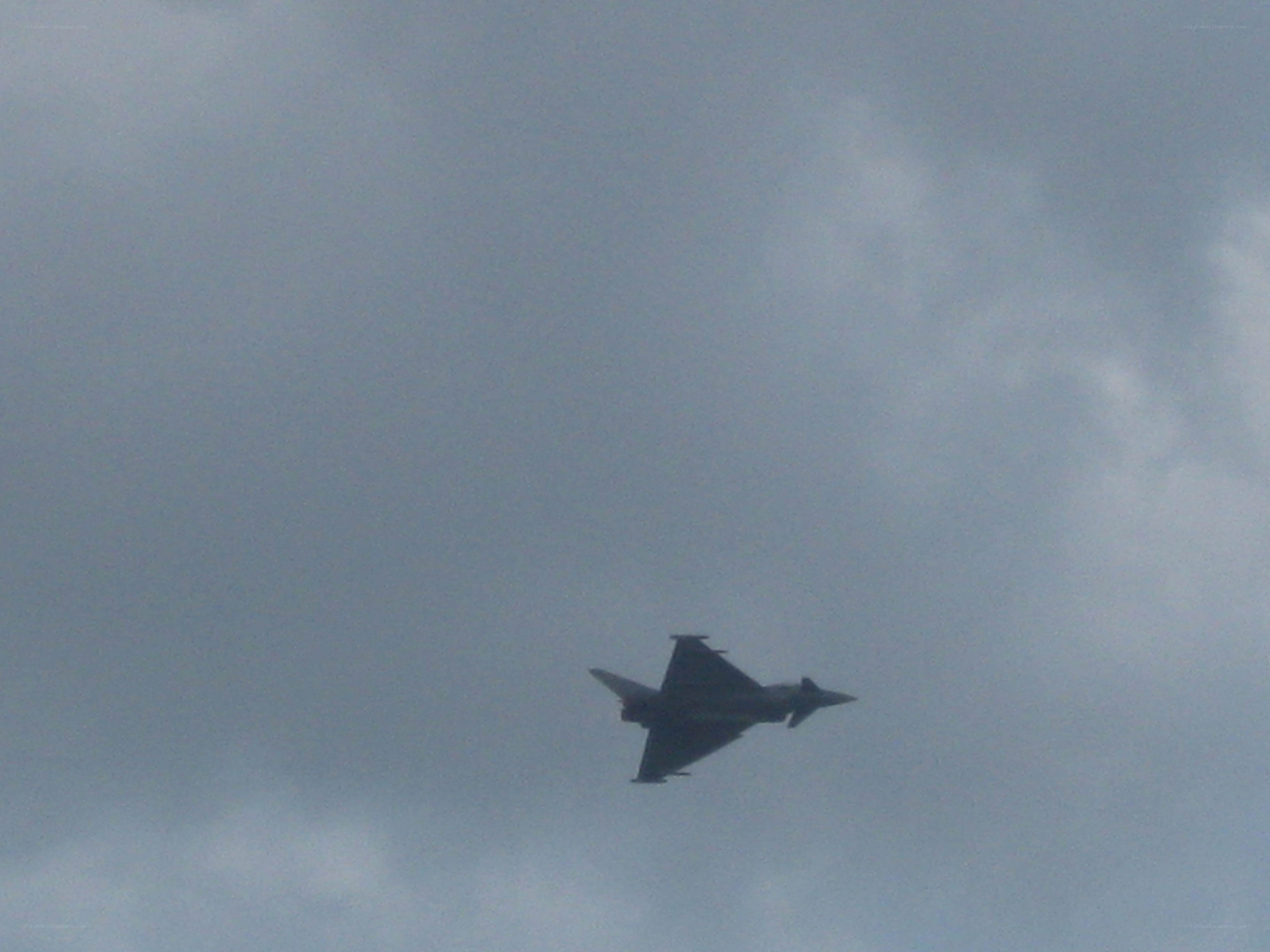 jet fighter in cloudy sky