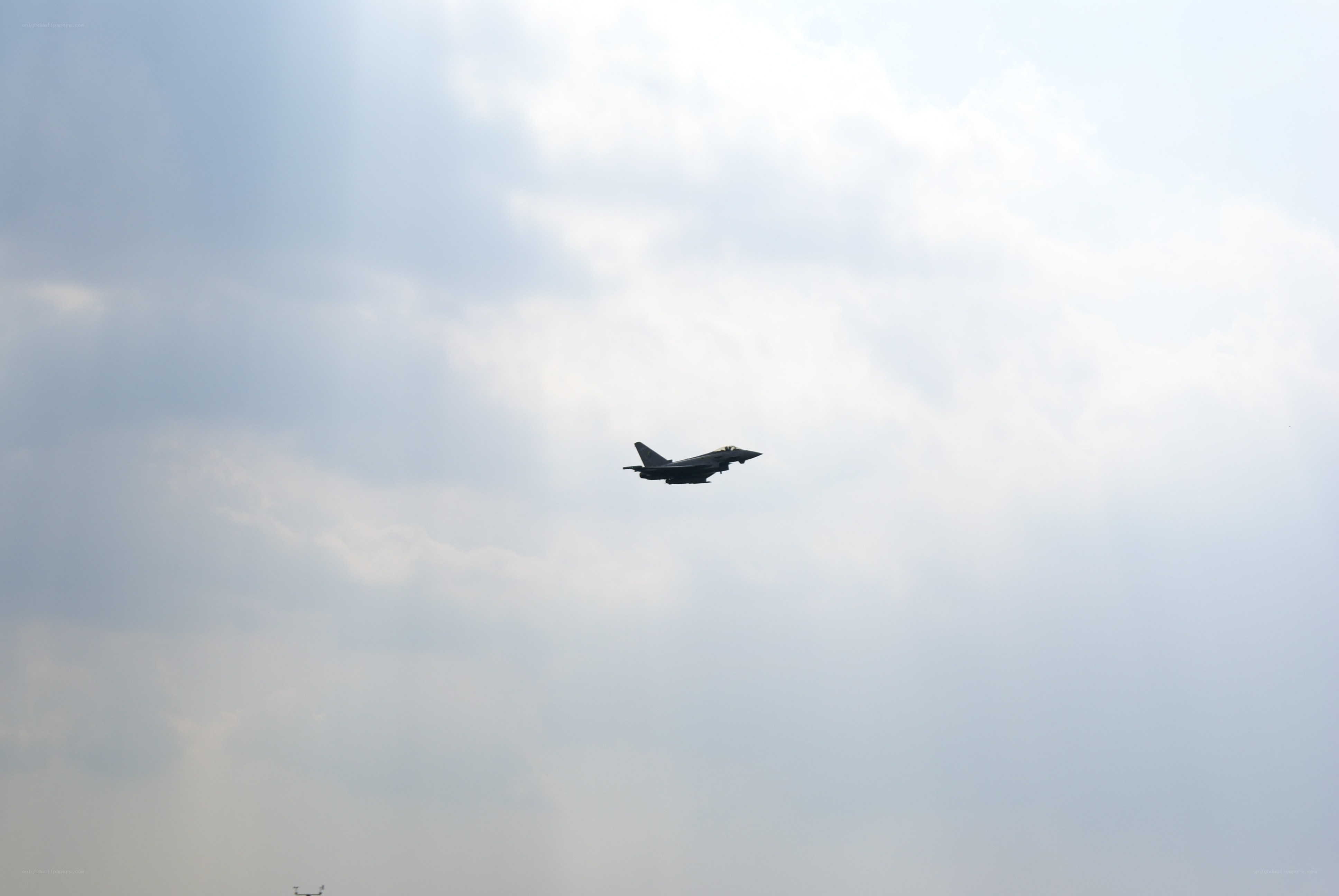 jet fighter in cloudy sky