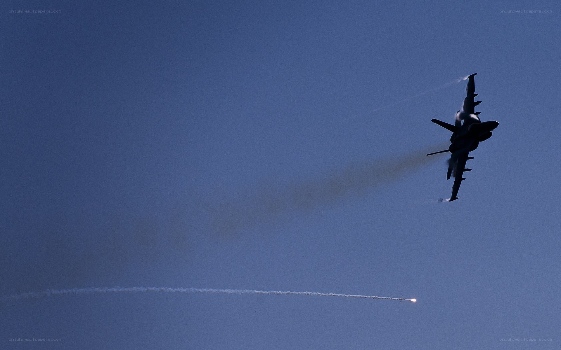 Jet fighter in flight with missile