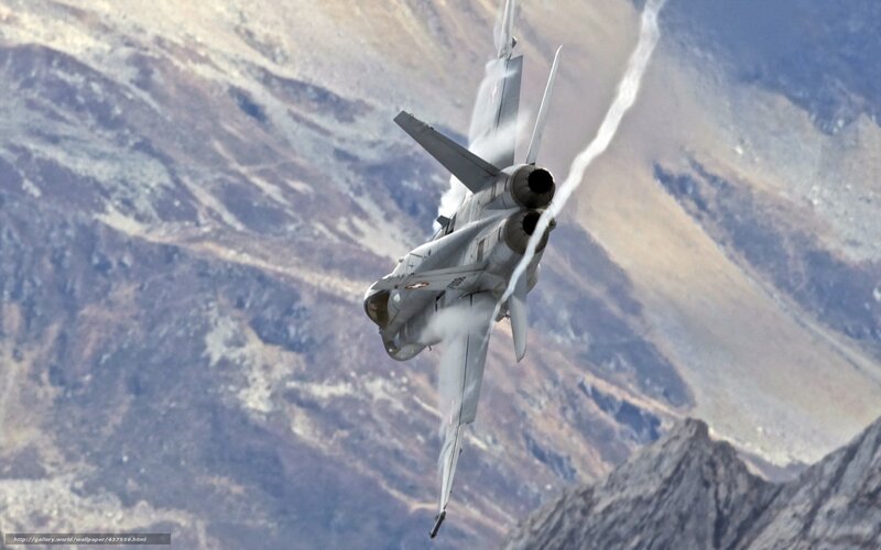 Jet fighter in mountainous terrain