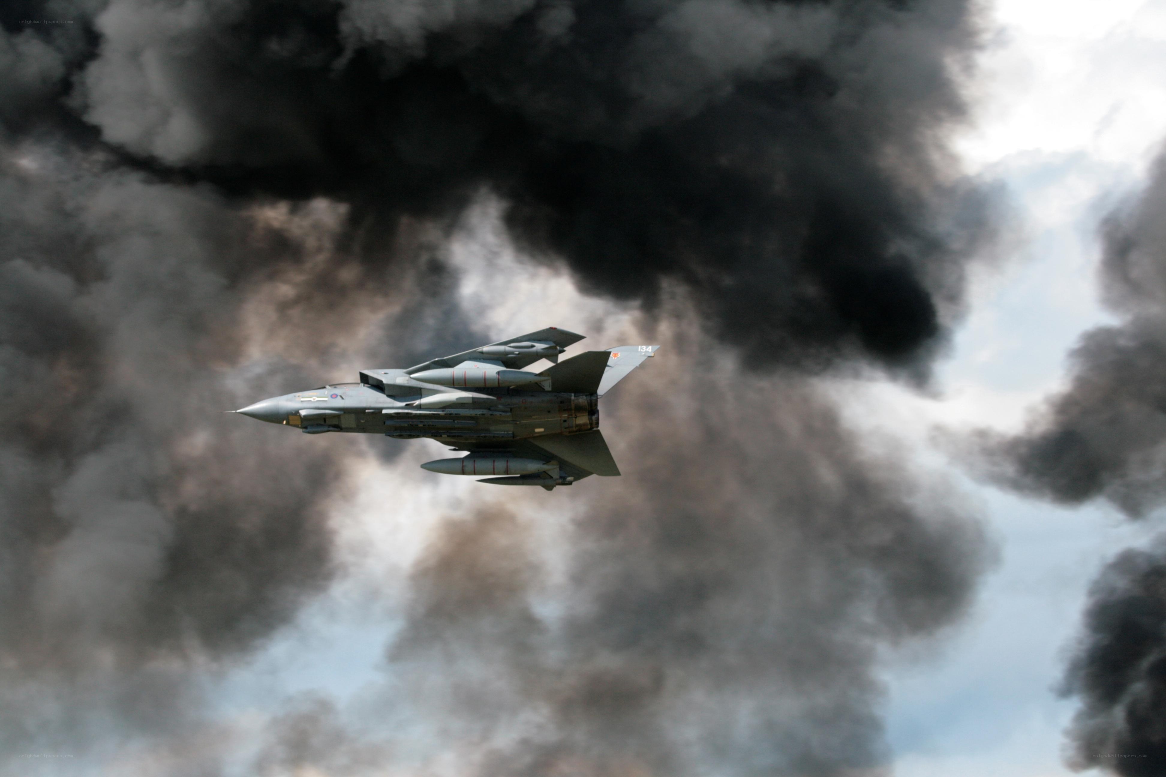 Jet fighter in smoke
