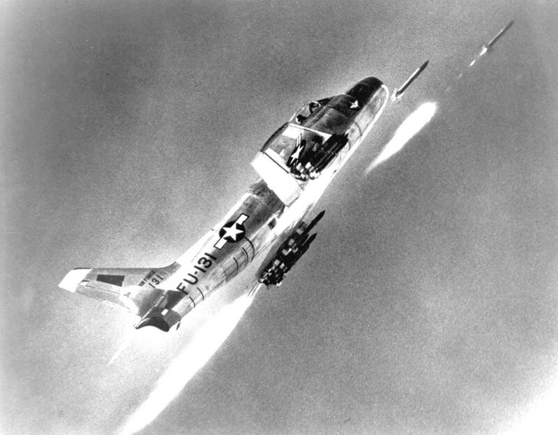 Jet fighter launching missiles