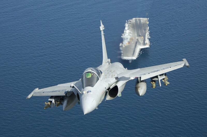 Jet fighter near aircraft carrier