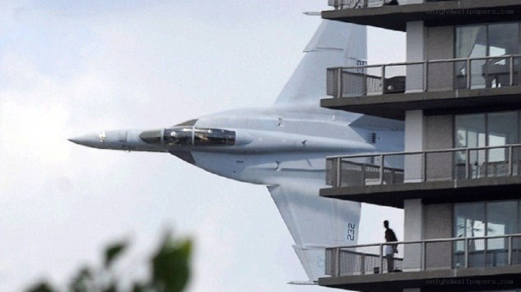 Jet fighter near apartment building
