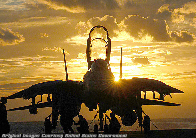 Jet fighter on aircraft carrier at sunset