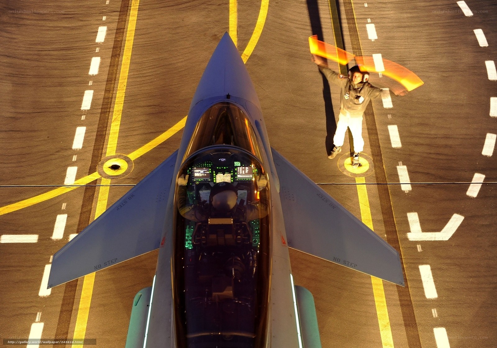 Jet fighter on tarmac with crew
