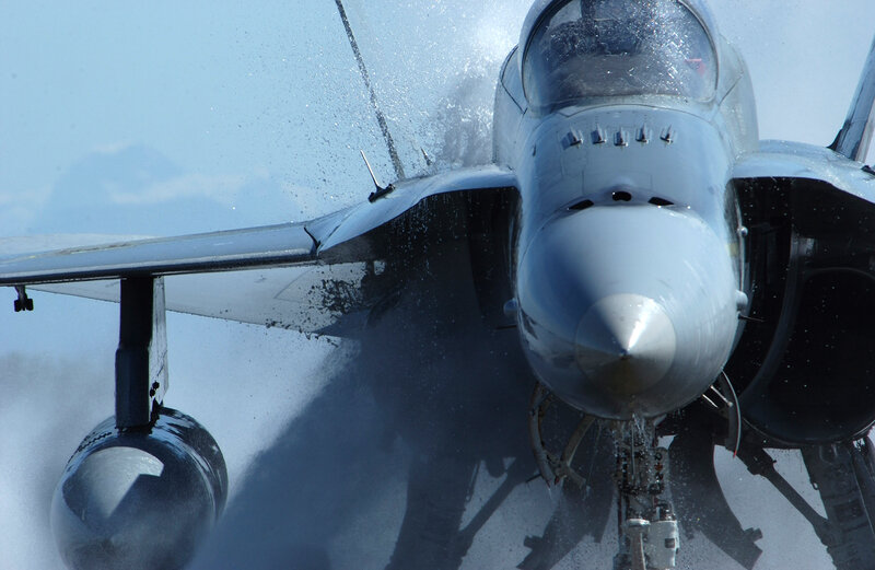 Jet fighter on wet runway