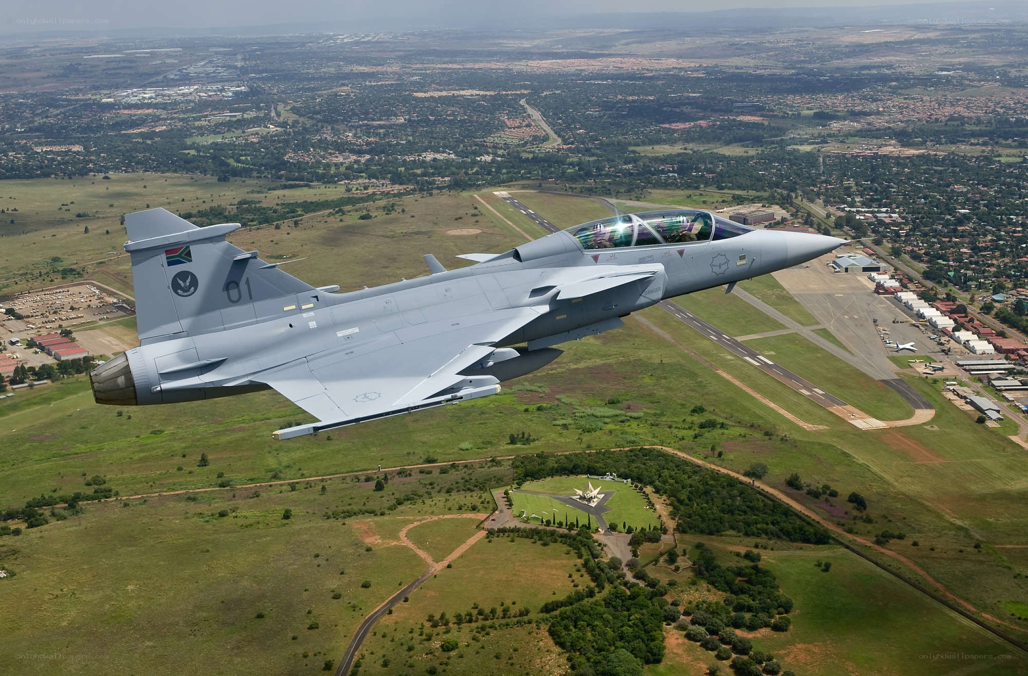 Jet fighter over airbase