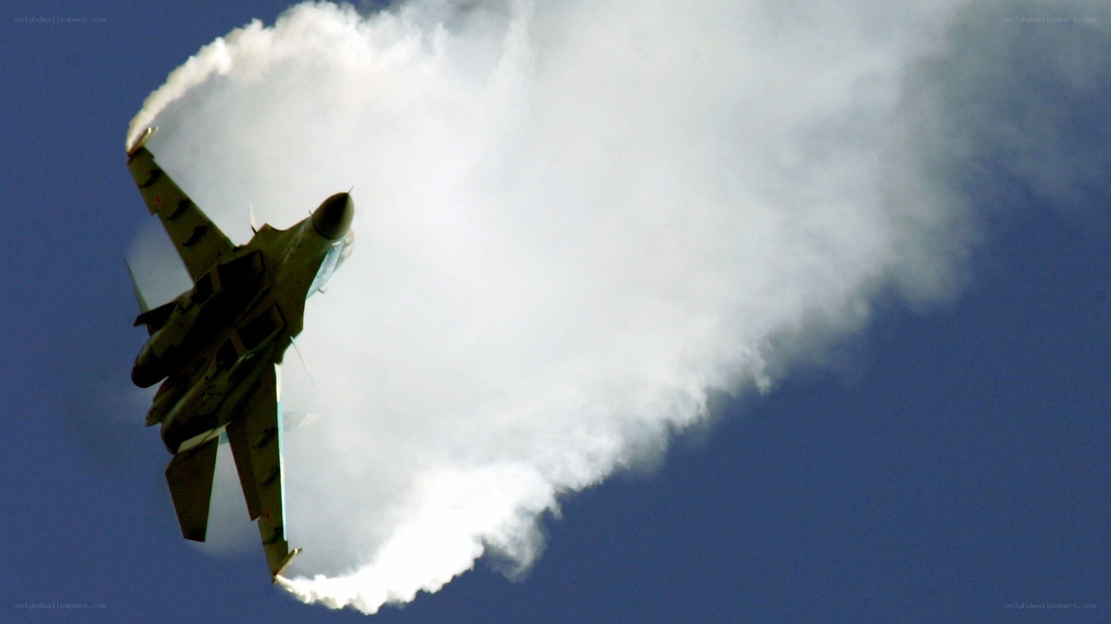 Jet fighter performing aerobatic maneuver