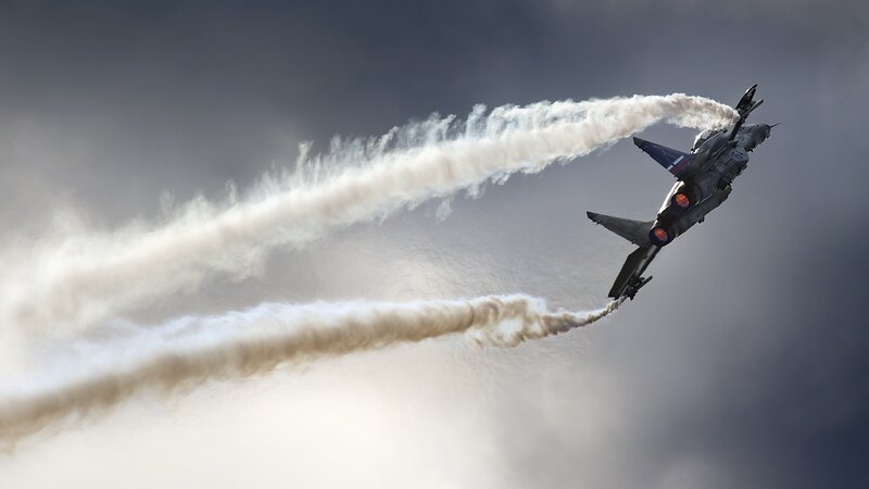 Jet Fighter Performing Aerobatics — Gray