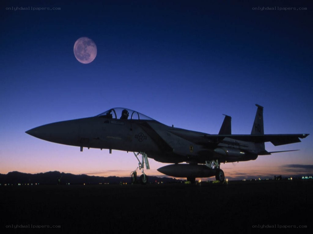 Jet fighter silhouette at dusk
