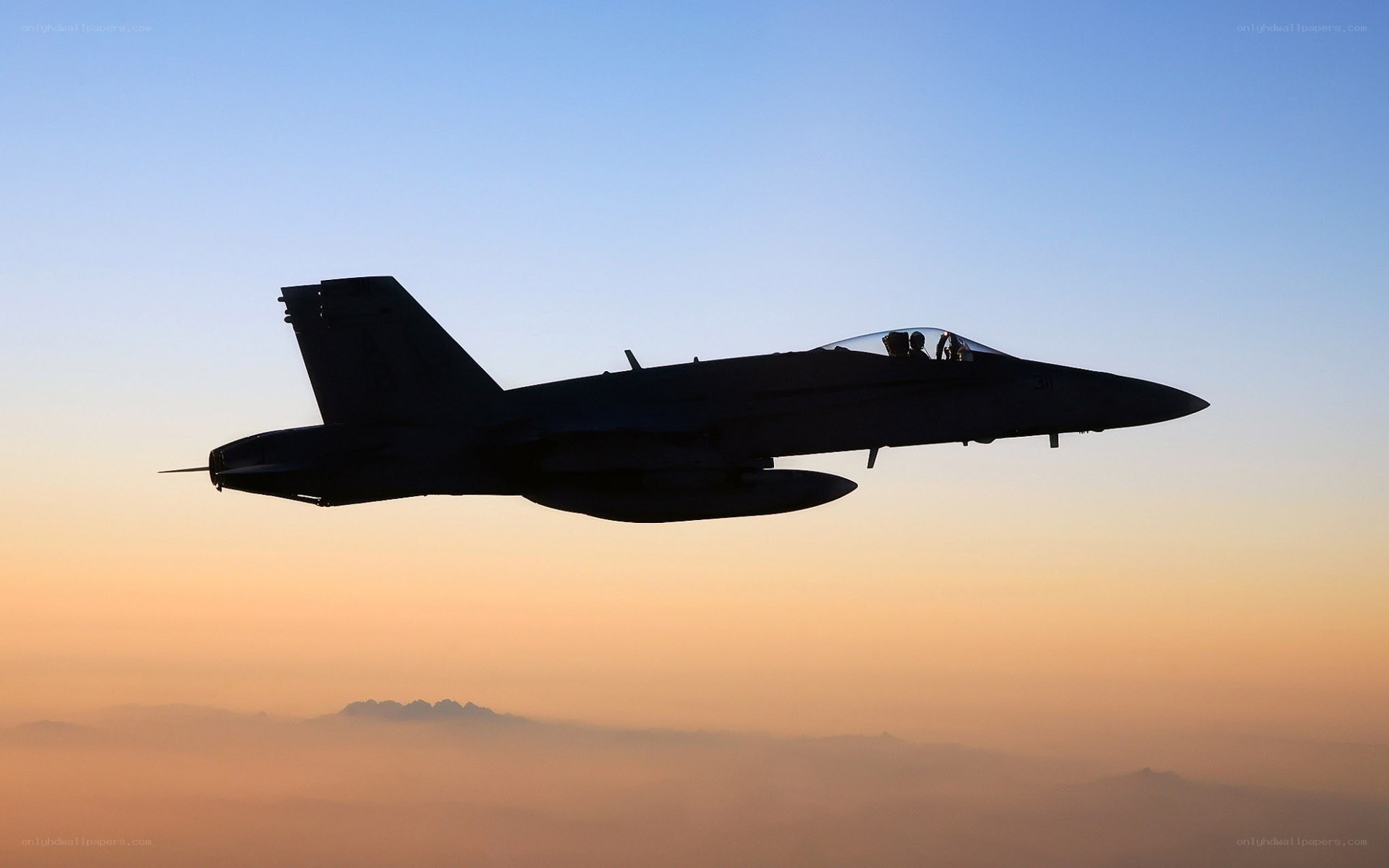 jet fighter silhouette at sunset
