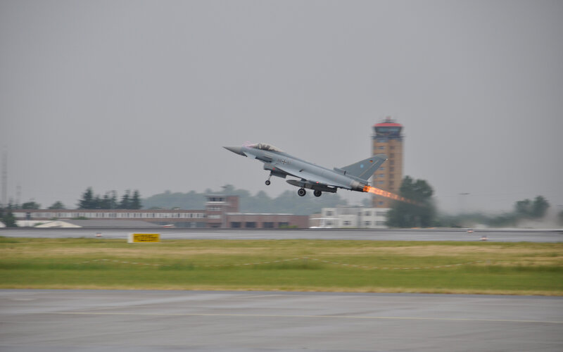Jet fighter taking off from runway