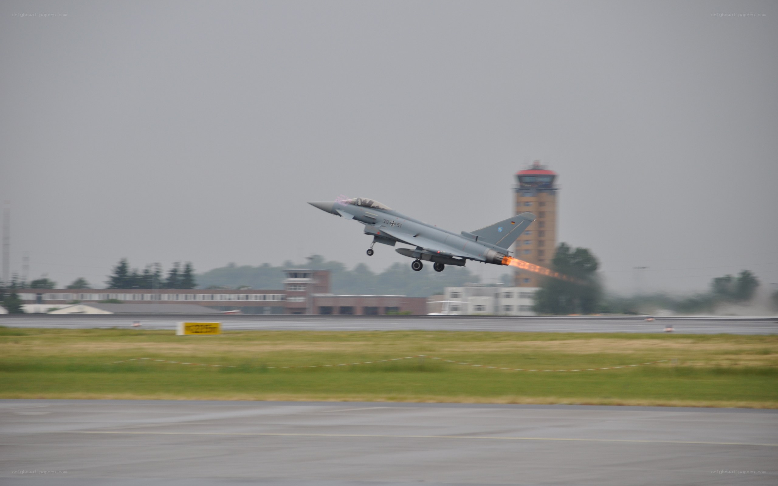 Jet fighter taking off from runway