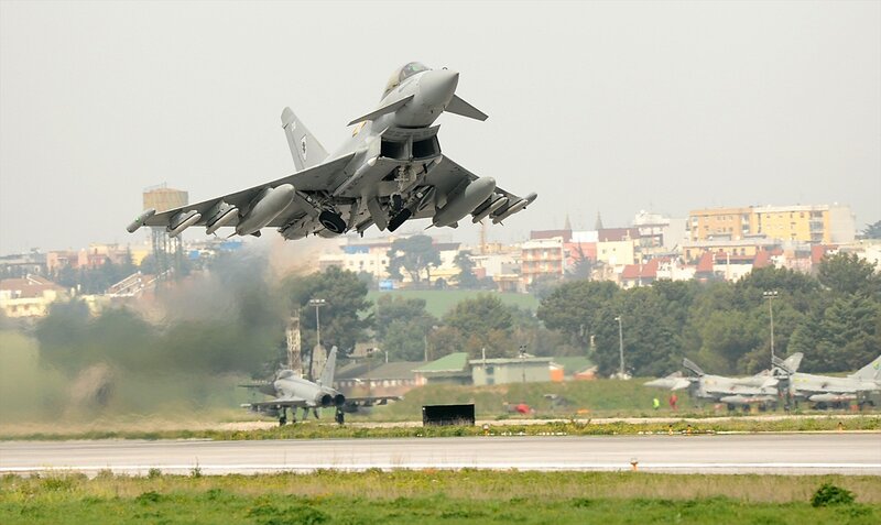 Jet fighter taking off from runway