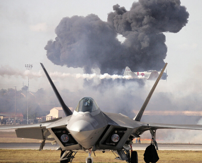 Jet fighter with smoke plume