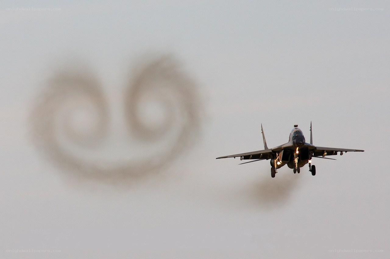 Jet fighter with smoke trails