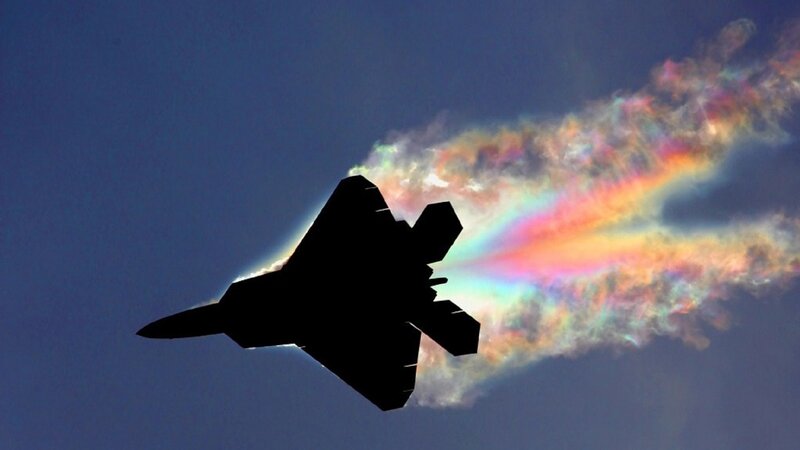 Jet fighter with vapor trail