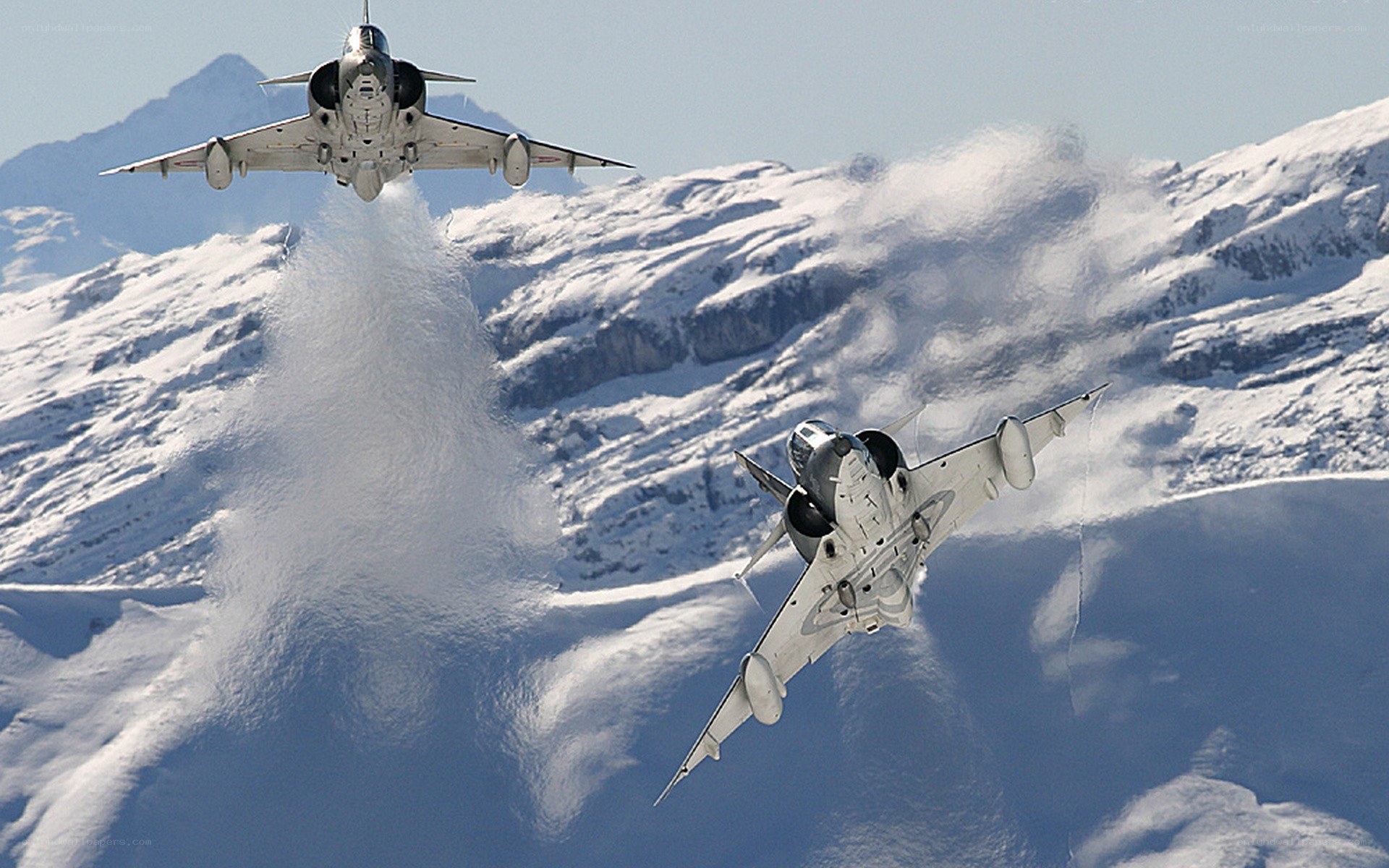 Jet fighters over snowy mountains