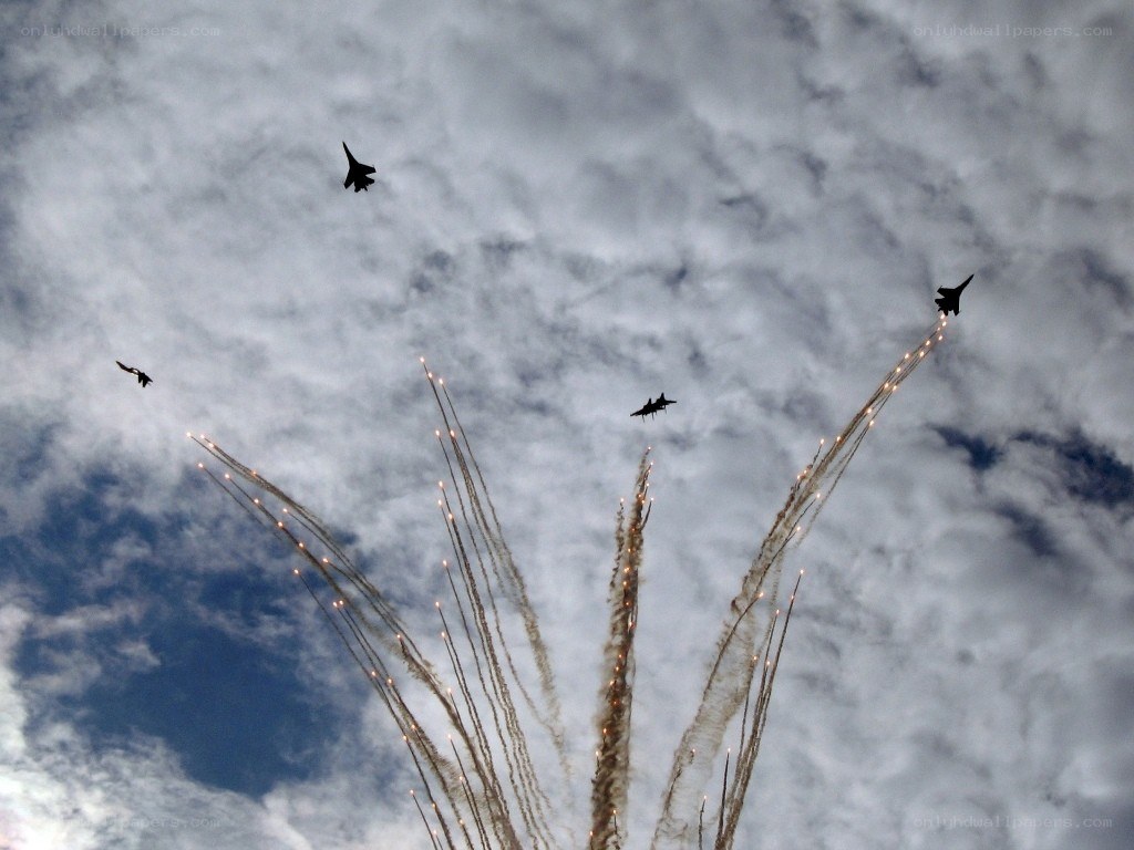 Jet fighters performing aerial display