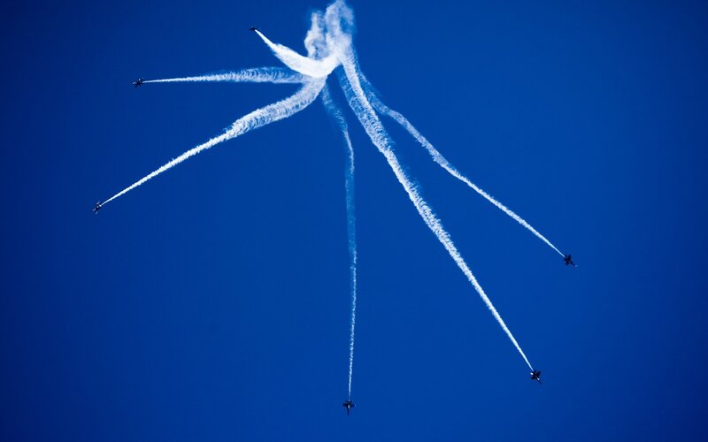 Jet fighters performing aerial display