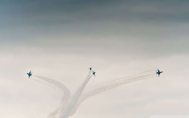 Jet fighters performing aerobatics