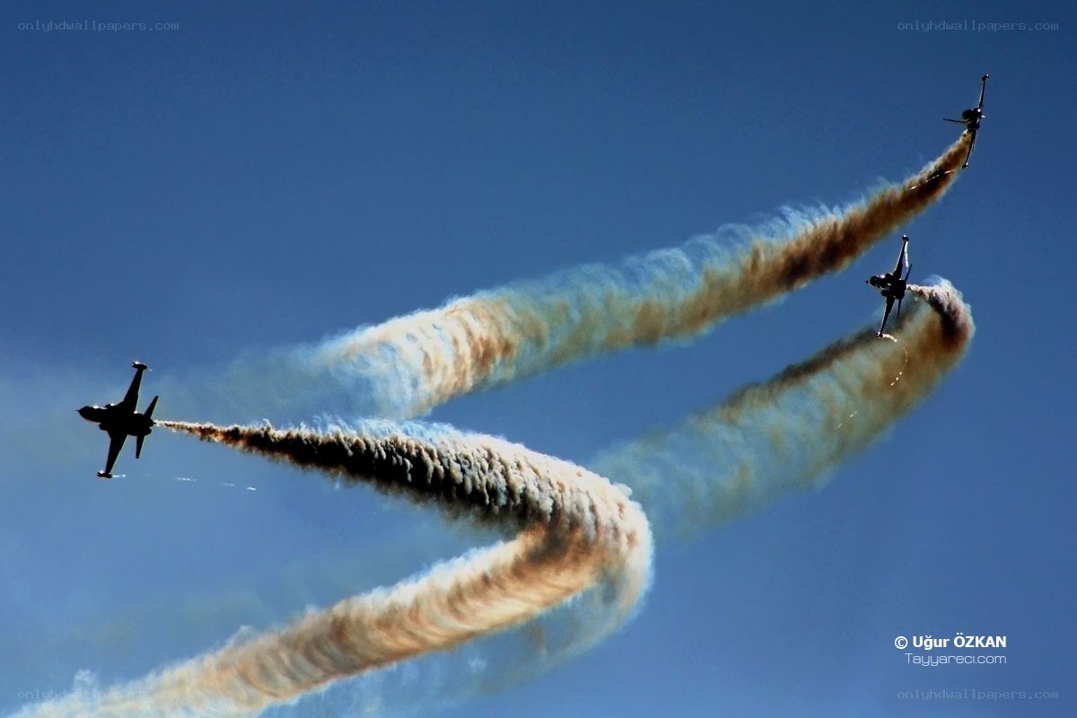 Jet fighters performing aerobatics