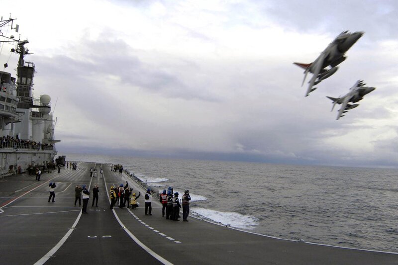 Jet fighters take off from aircraft carrier