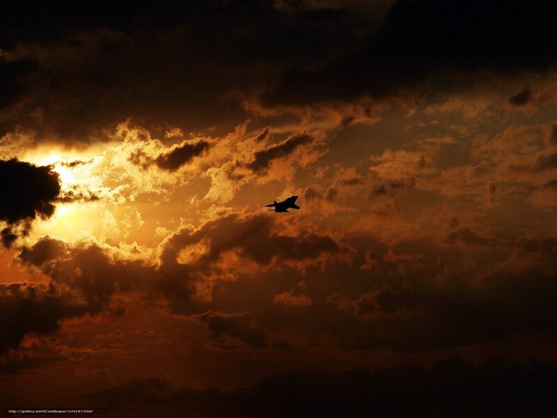 Jet flying at sunset