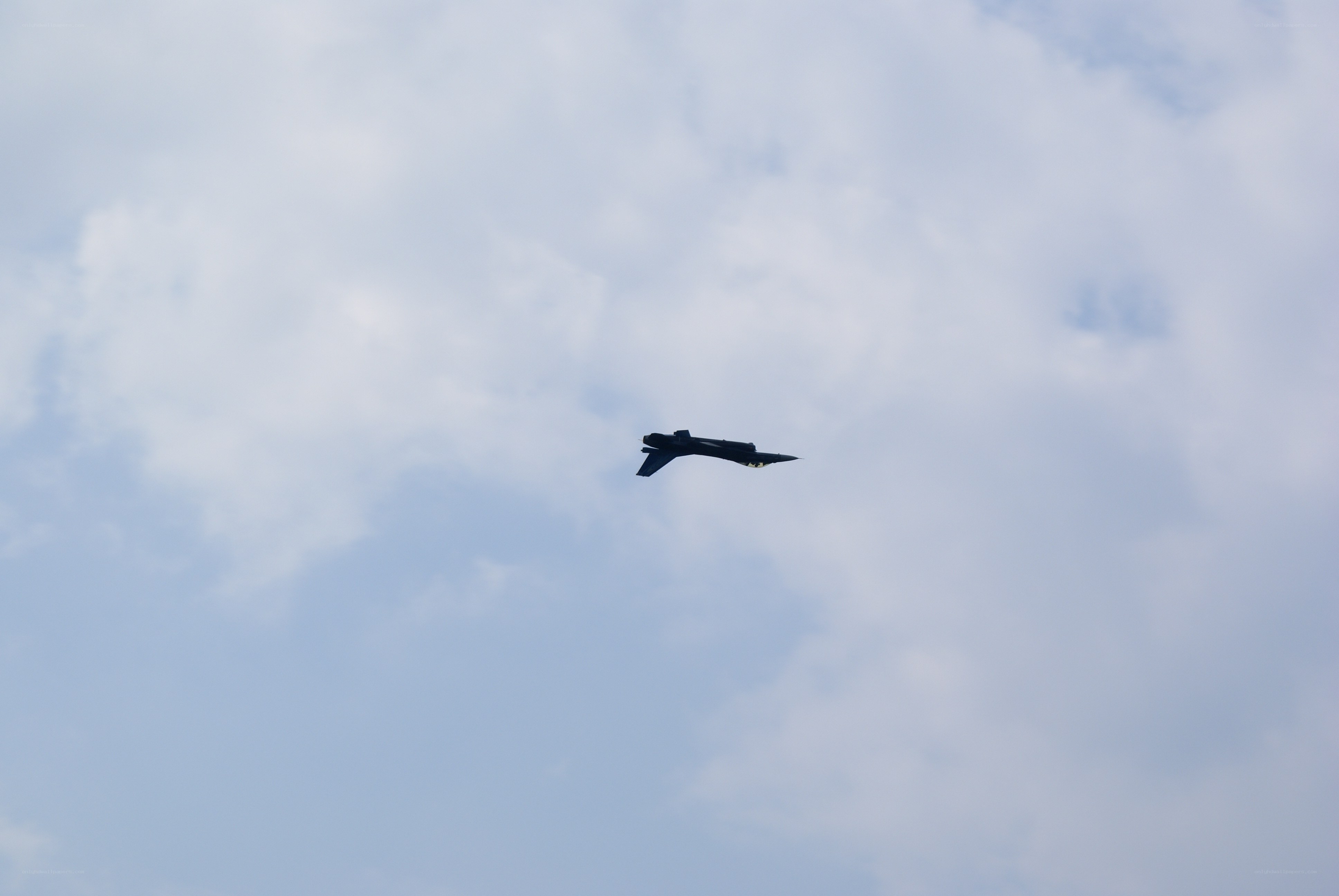 Jet flying in cloudy sky