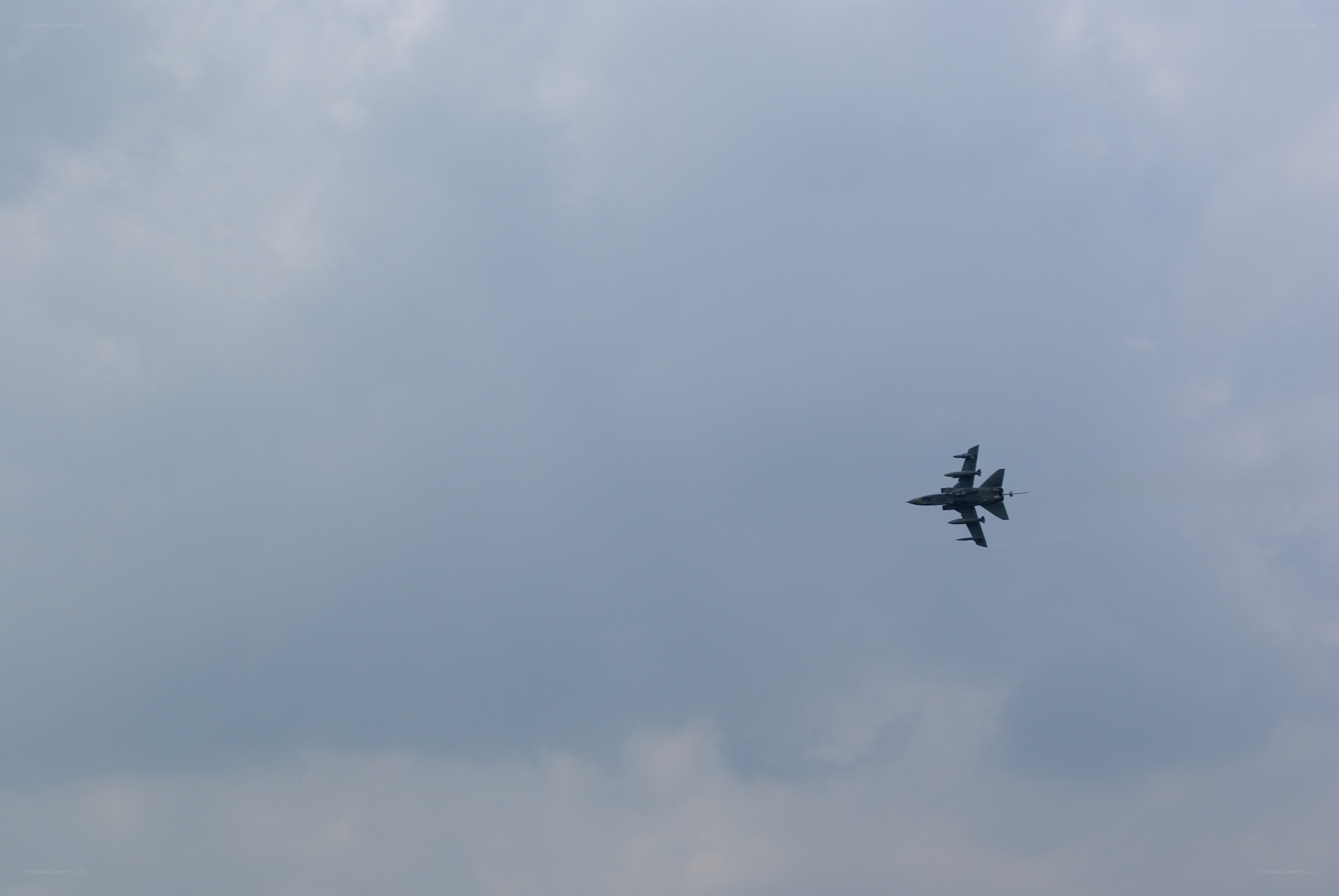 Jet flying in cloudy sky