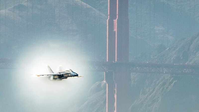 Jet flying near Golden Gate Bridge