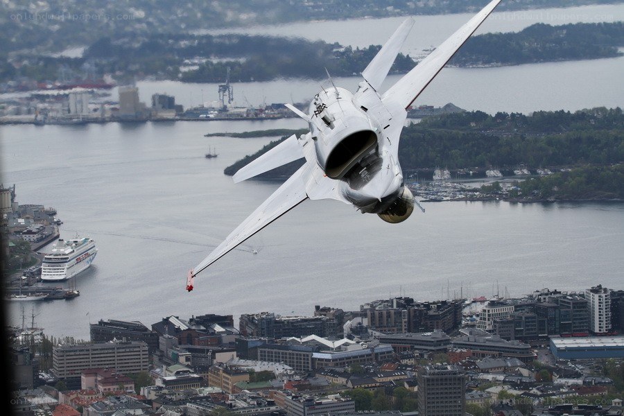 Jet flying over a city