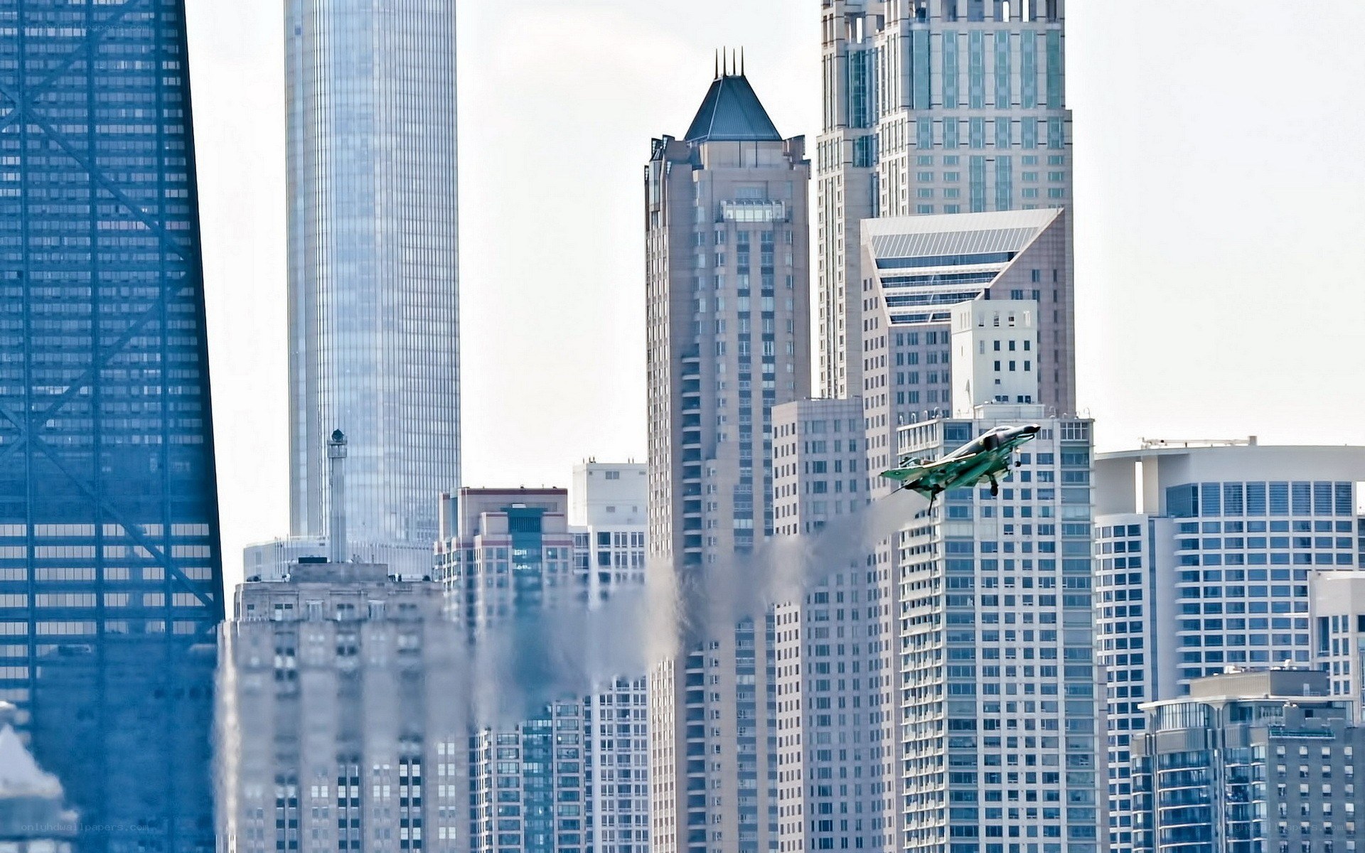 Jet flying over city skyline