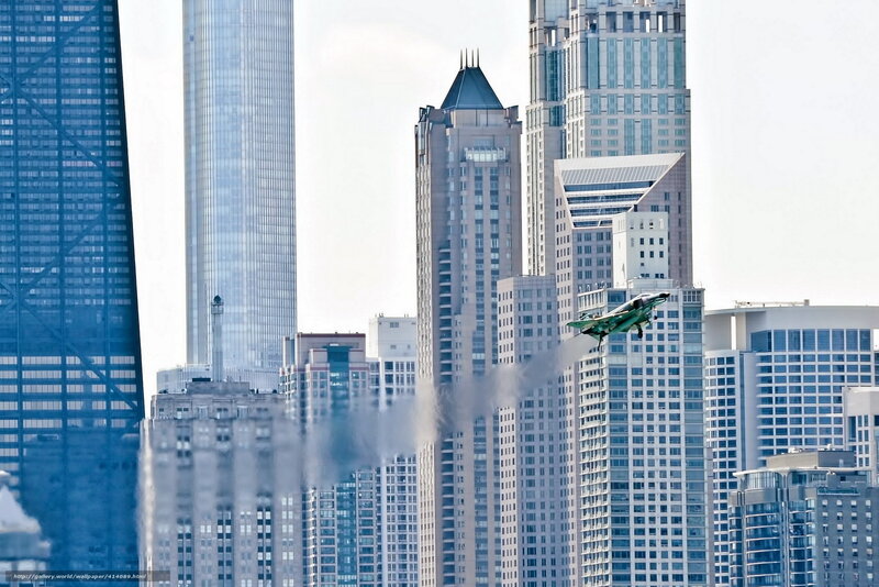 Jet flying over city skyline
