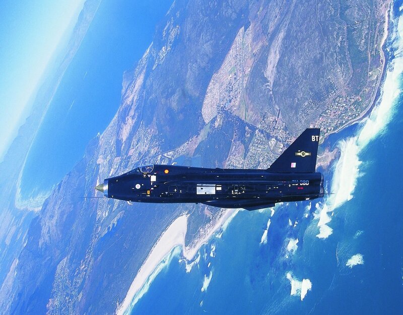 Jet flying over coastline