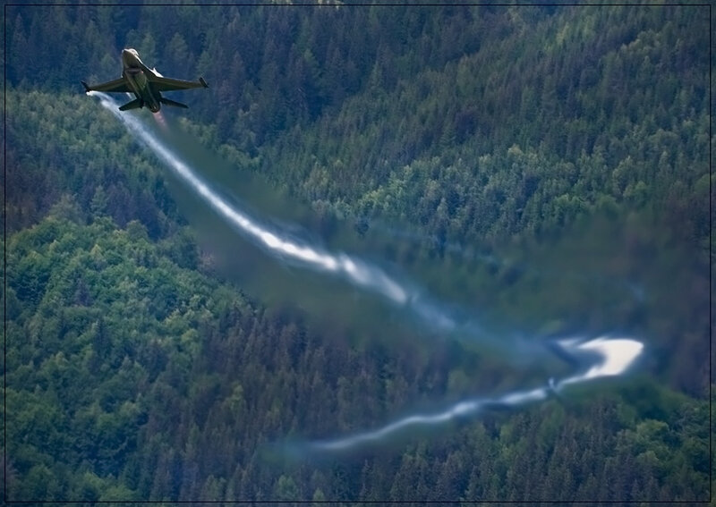 Jet flying over forest