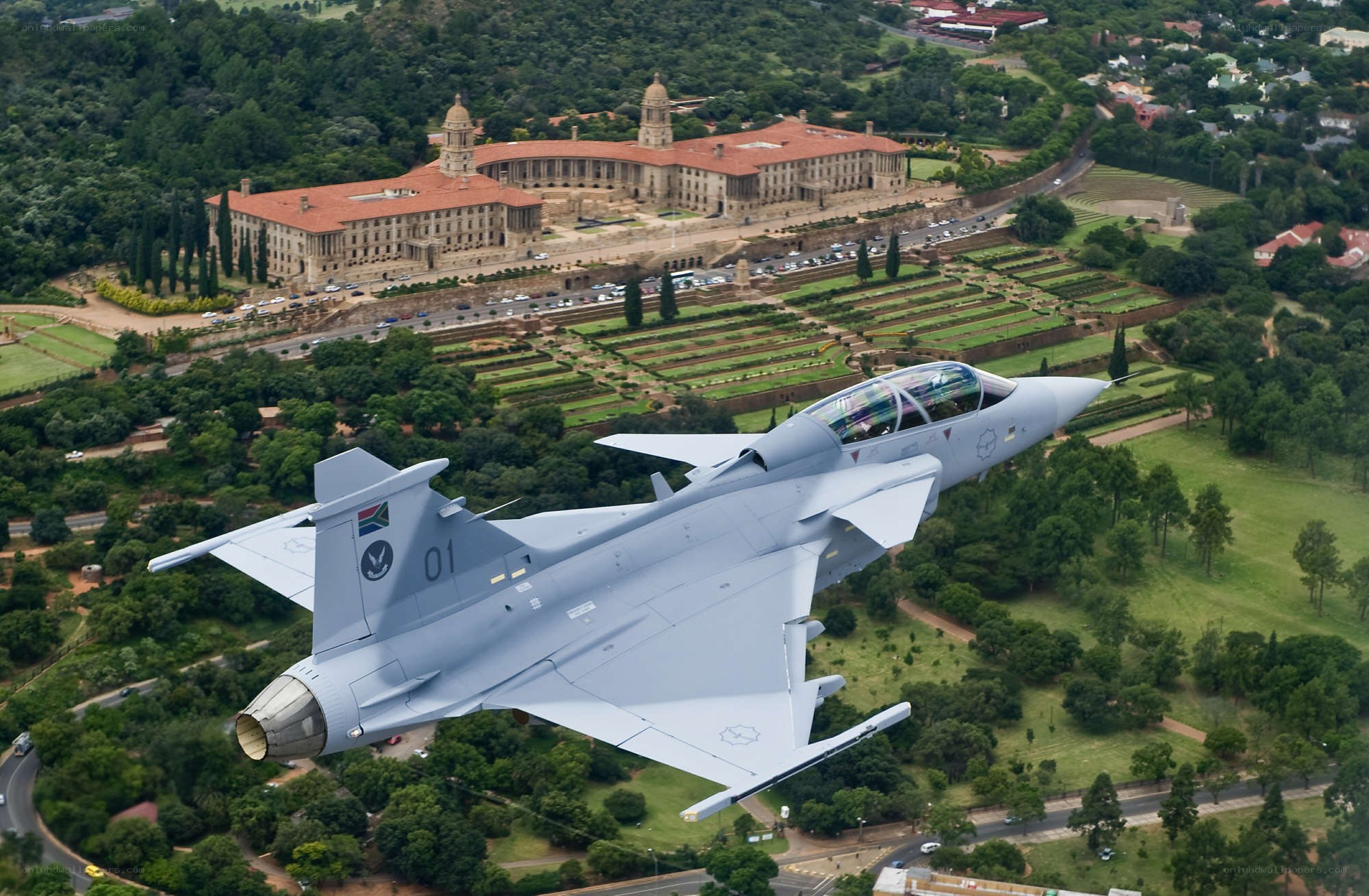 Jet flying over government building