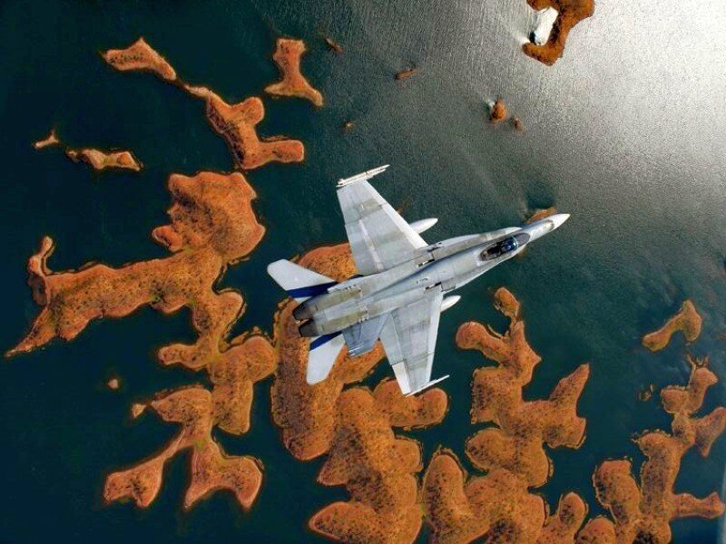 Jet flying over islands