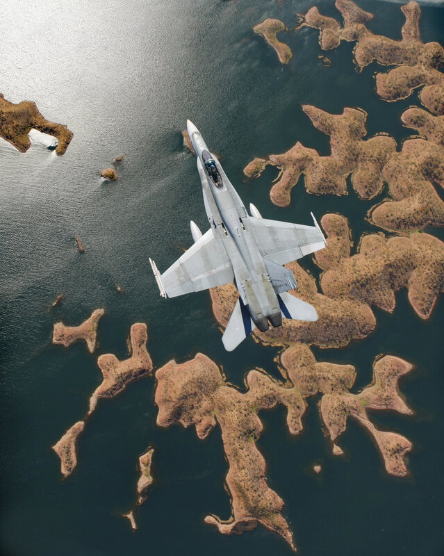 Jet flying over islands