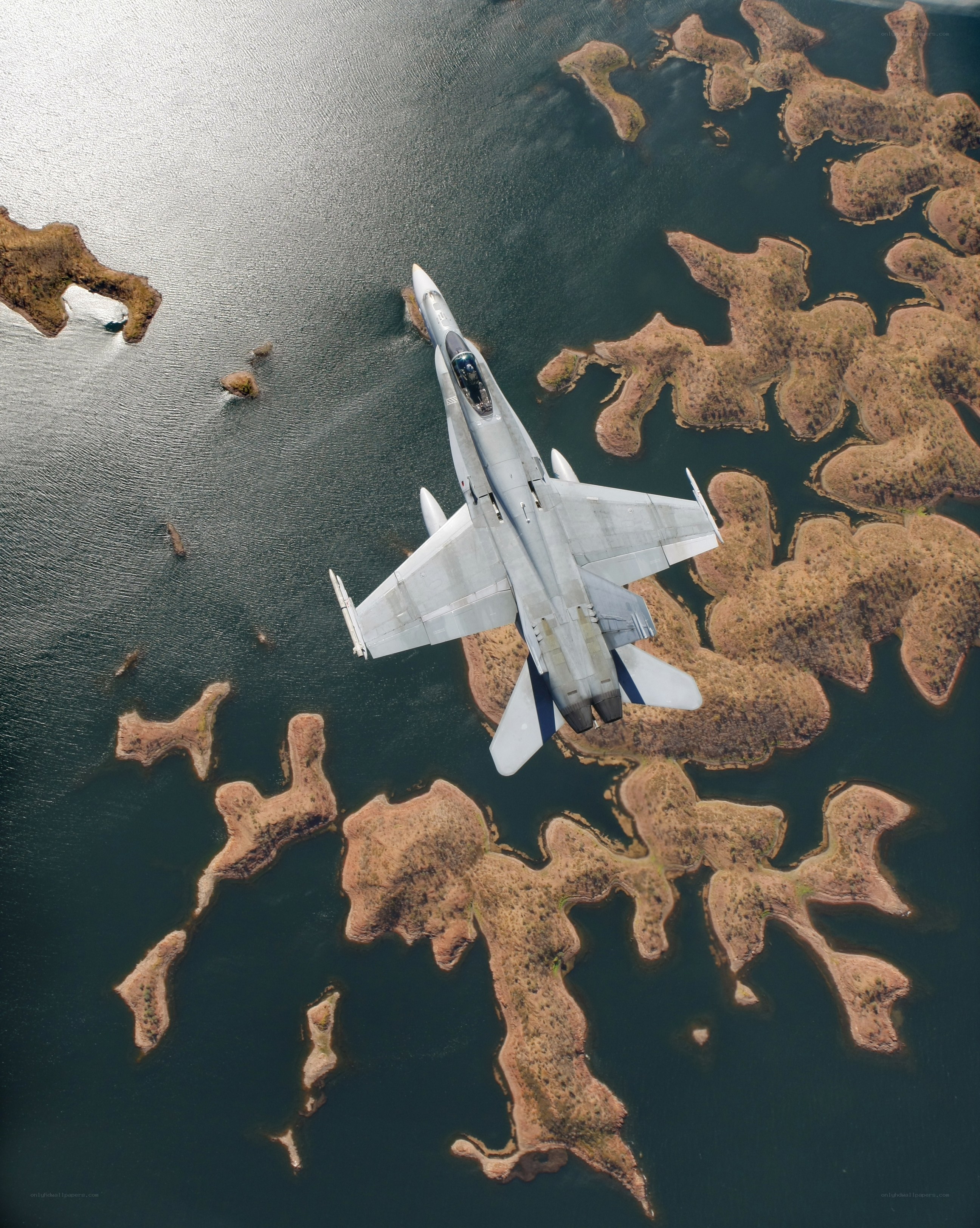 Jet flying over islands