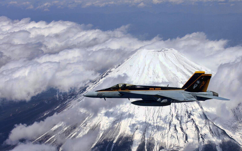 Jet flying over Mount Fuji