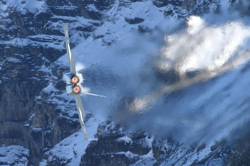Jet Flying over Mountains — Blue