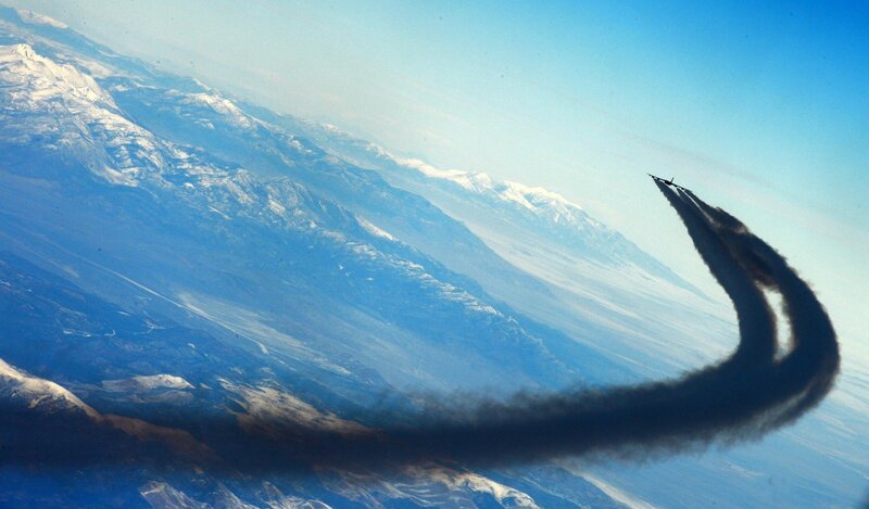 Jet flying over mountains