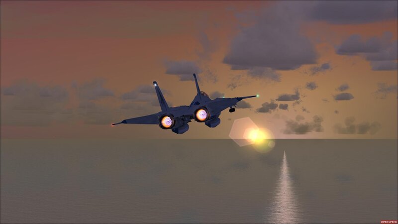 jet flying over ocean at sunset