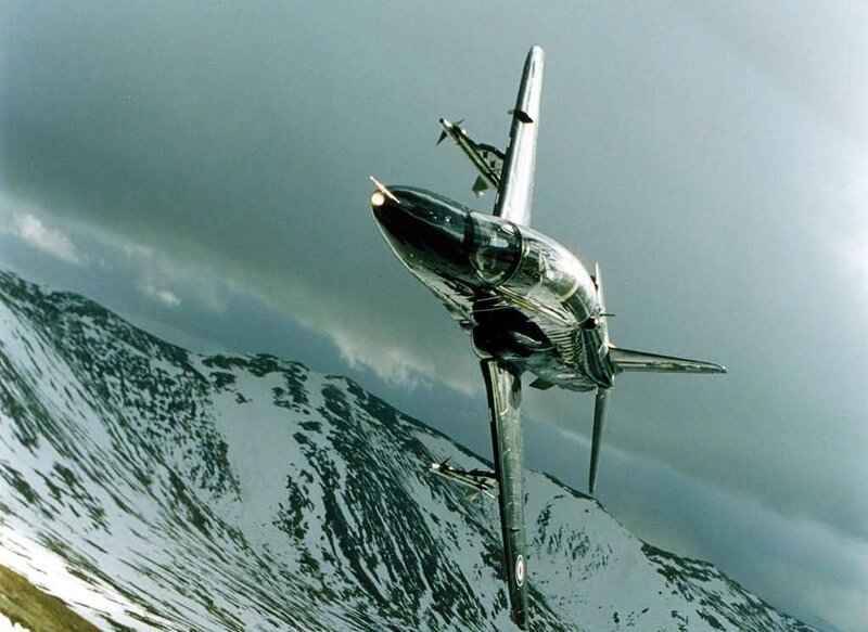 Jet flying over snowy mountains