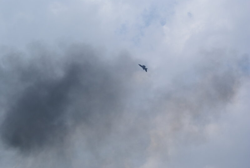 Jet flying through cloudy sky