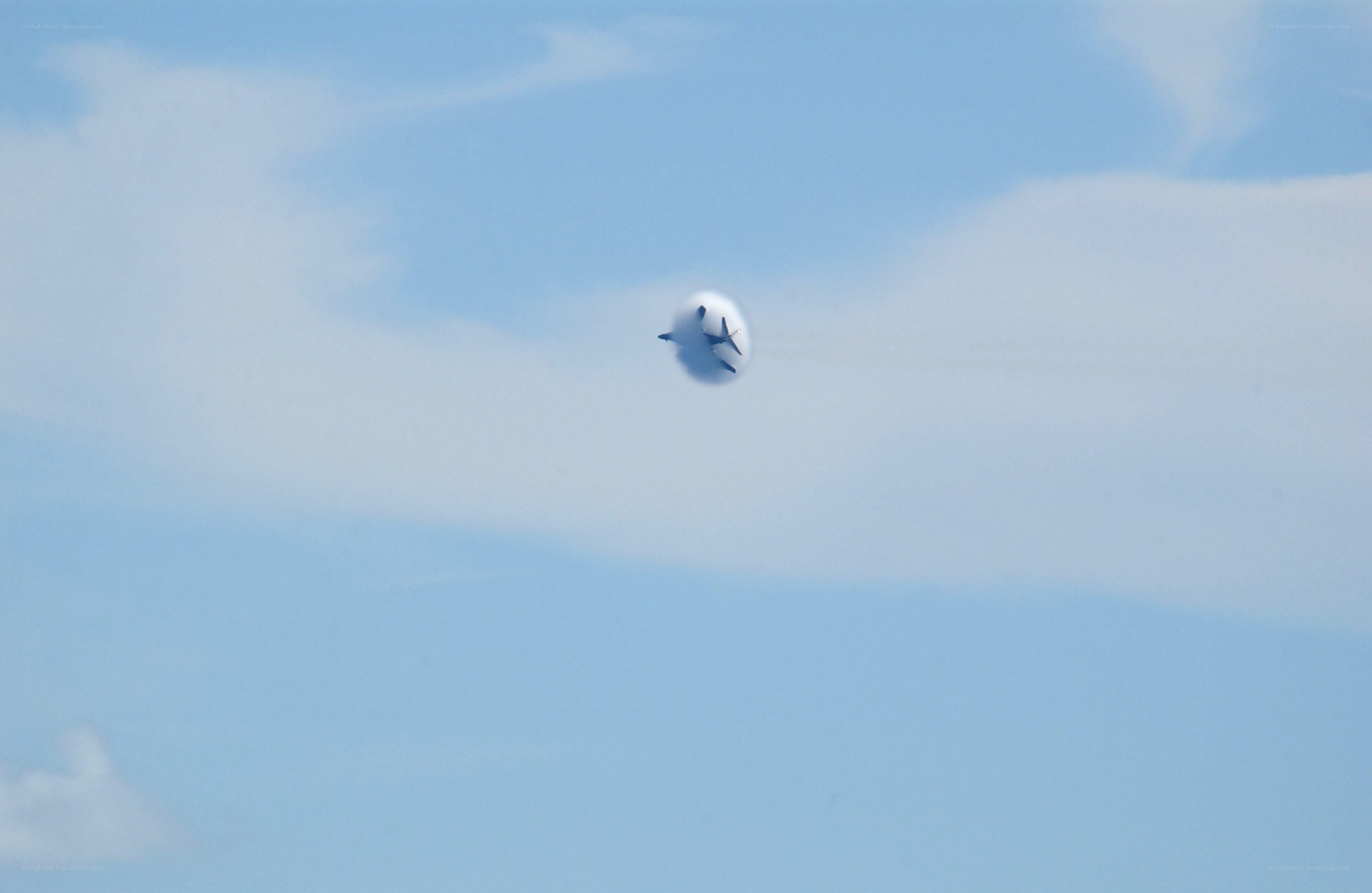 Jet flying through vapor cone