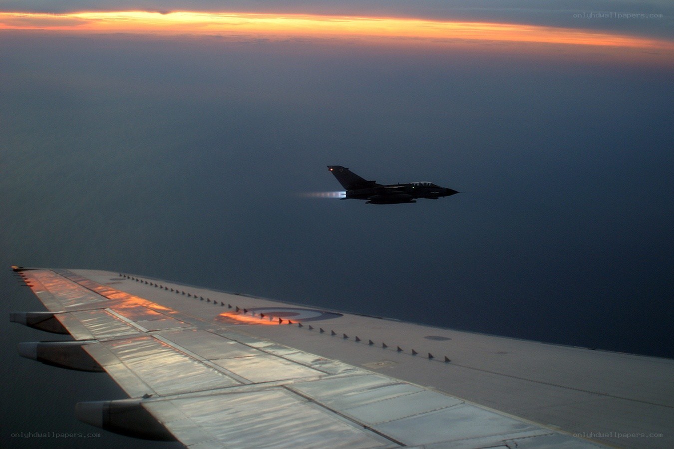 Jet in flight at sunset